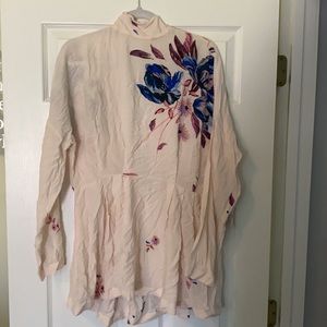 Free People Women’s shirt. NWT. Light pink with floral design. Size medium.